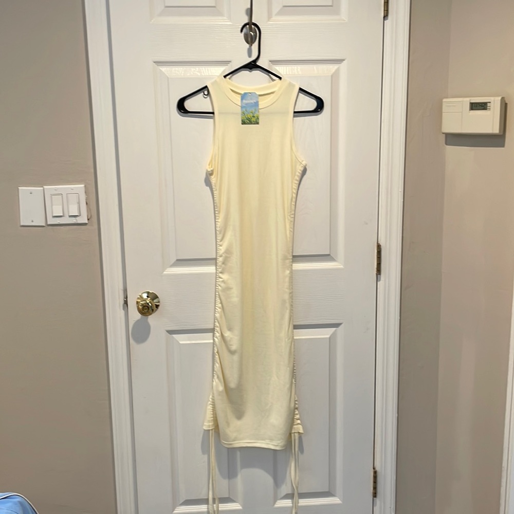 Stretchy dress in creme color from Sunday Soho in NYC. adjustable length!